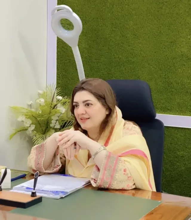 Dr Taskeen Iqbal in consultation at her clinic desk in Bahria Town, Rawalpindi